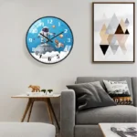 A wall clock featuring an astronaut floating in space surrounded by planets and stars, perfect for science-themed decor or educational settings.