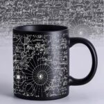 Black ceramic mug featuring white mathematical equations, geometric diagrams, and scientific formulas, perfect for science enthusiasts and students.