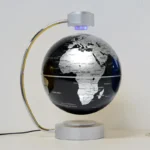 Modern black and white globe lamp with LED lighting, perfect for educational decor and science enthusiasts.