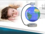 Child sleeping peacefully next to an educational Earth globe projector displaying a 3D map of the world in a modern bedroom.