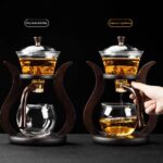 Innovative double-stage tea infuser with a glass teapot and stand, designed for precise brewing and serving of tea. Perfect for tea enthusiasts and educational demonstrations.