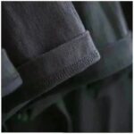 A close-up of a dark fabric sleeve with detailed stitching, highlighting the quality and craftsmanship of science-themed apparel or accessories.