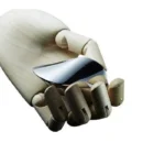Close-up of a robotic hand with a metallic claw, showcasing advanced robotics and mechanical design.