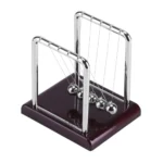 Newton's Cradle with metal balls and wooden base, demonstrating conservation of momentum and energy. Perfect for science education, office decor, and physics demonstrations.