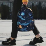 A space-themed backpack featuring planets, stars, and cosmic clouds, perfect for students and space enthusiasts. Durable and stylish, ideal for school or travel.
