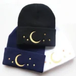 Black beanie with moon and star embroidery, cozy winter accessory.