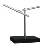 A metallic model illustrating magnetic field lines with two rods positioned at angles, mounted on a black base for educational science demonstrations.