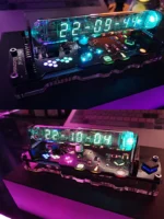 Modern digital LED clock featuring a transparent circuit board and colorful illuminated components, showcasing innovative electronic design and futuristic aesthetics.