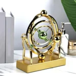 Elegant gold and green planetary model demonstrating atomic or planetary motion, perfect for science decor and educational purposes.
