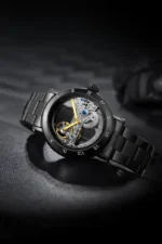 Close-up of a luxury skeleton mechanical watch with a black metal band, showcasing intricate gears and a transparent dial, on a dark background.