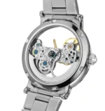 Close-up of a watch movement with visible gears and components through a transparent case back.
