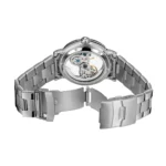 Silver skeleton mechanical watch with visible gears and transparent dial, showcasing intricate watch movement and craftsmanship.