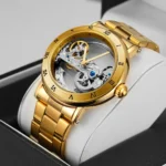 Elegant gold skeleton watch showcasing intricate mechanical gears and Roman numeral markers, perfect for watch enthusiasts and collectors.