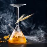 Glass flask with wheat and dry ice, creating fog and smoke effects.