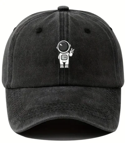 Black baseball cap featuring a small astronaut graphic with a helmet and space suit, perfect for science enthusiasts and space lovers.