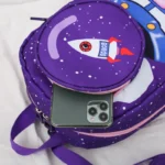 Backpack featuring a colorful rocket ship design with "space" label, perfect for young science enthusiasts. Durable, fun, and educational, ideal for school or travel.