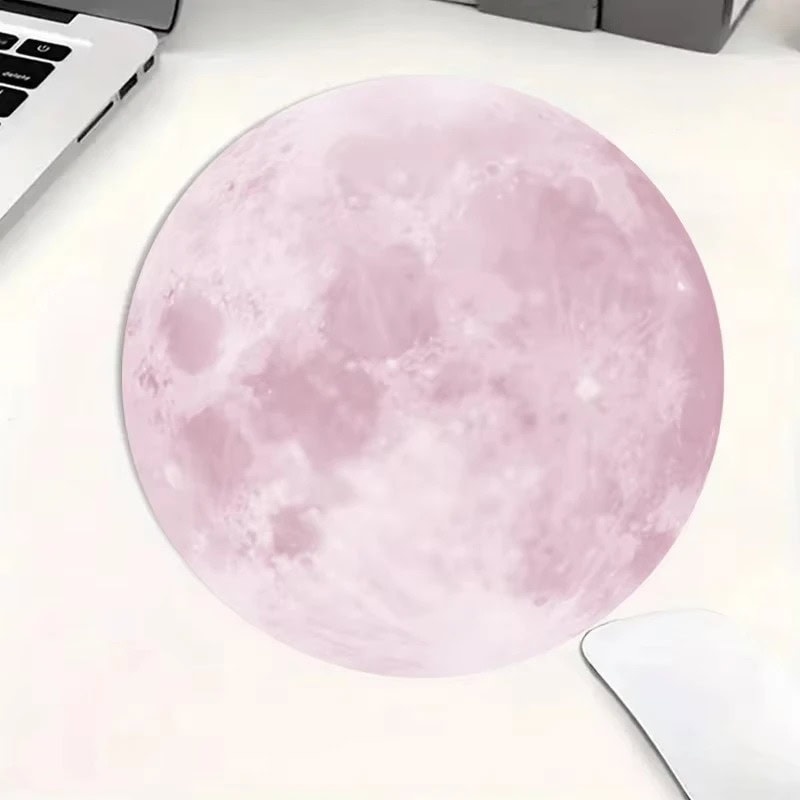 Moon Lamp with Pink Hue Realistic pink moon lamp on a white surface, perfect for science decor and educational spaces.