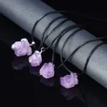 Amethyst crystal pendant necklace with black cord, perfect for science lovers and gemstone jewelry fans.