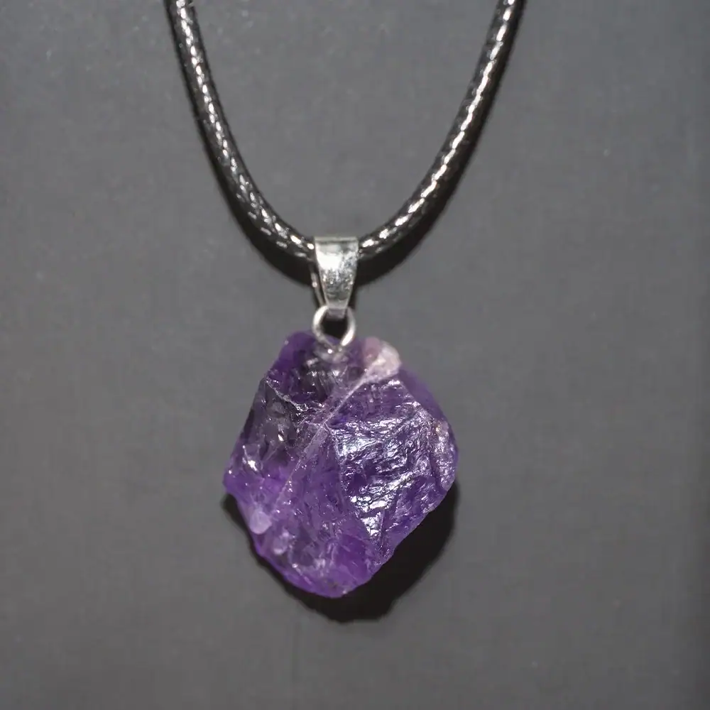 Amethyst Crystal Pendant Necklace Amethyst crystal pendant necklace with a silver chain, showcasing a raw purple gemstone. Perfect for science-inspired jewelry and educational gift ideas.