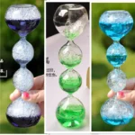 Colorful glass hourglass with bubbles for science experiments and decor.