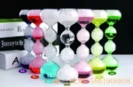 Colorful glass hourglasses with sand and liquid, decorative science-themed items for educational and home decor purposes.