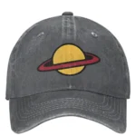 Planet Saturn embroidered cap with red ring detail on yellow background, vintage style.