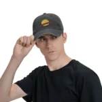 Young man wearing a black cap with a colorful planet and ring design, showcasing a space-themed fashion accessory.