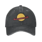 A black baseball cap featuring a yellow planet with a red ring around it, representing a space-themed design.