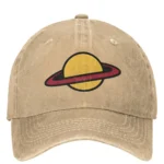 Beige baseball cap with embroidered yellow sun and red ring planet design, casual accessory for science enthusiasts.
