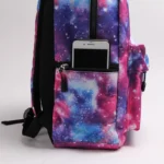Colorful galaxy-themed backpack featuring a front pocket with a smartphone inside, ideal for students and space enthusiasts.