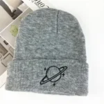 Space-themed gray beanie with embroidered planet and ring design, perfect for casual wear and outdoor activities. Made from soft, warm fabric, suitable for all seasons.