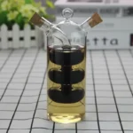 Glass science experiment apparatus with black liquid and cork stoppers.
