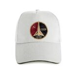 White baseball cap featuring a vintage Soviet space program emblem with a rocket, hammer and sickle, and "CCCP" text, symbolizing Cold War space exploration.
