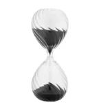 Clear black and white sand timer demonstrating time measurement for educational and science activities.