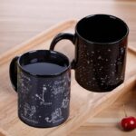 Black ceramic zodiac mugs featuring star constellations and zodiac signs, perfect for science and astronomy enthusiasts.
