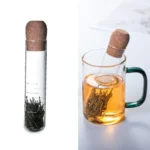 Innovative tea infuser in a test tube with tea leaves, perfect for science-themed kitchen accessories and educational science gadgets.