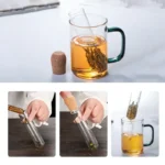 Glass tea infuser with tea leaves and hot water in a mug.