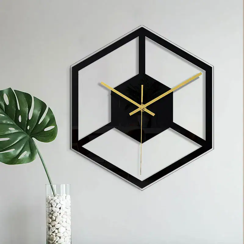 Modern Geometric Wall Clock Stylish black and gold geometric wall clock with a 3D cube design, mounted on a white wall, adding a contemporary touch to home decor.