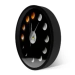 Modern moon phase wall clock with black frame showing lunar cycle phases from new moon to full moon, ideal for science enthusiasts and educational decor.