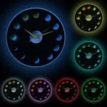 Glow-in-the-dark wall clock featuring moon phases with luminous colors in blue, yellow, green, purple, red, and pink, perfect for science decor and educational purposes.