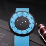 Stylish blue wristwatch featuring a distinctive circular dial with black and red indicators, perfect for science enthusiasts and fashion-forward individuals.