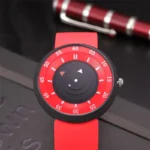 Unique red and black educational watch with rotating discs for teaching time.