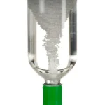 A science demonstration showing magnetic levitation with a glass tube and magnetic particles suspended inside, illustrating magnetic forces and fluid dynamics.