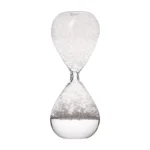 Hourglass timer with white sand, ideal for science-themed decor and educational toys. A classic symbol of time measurement and scientific exploration.