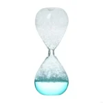 Elegant glass hourglass timer with blue liquid and white sand, symbolizing the passage of time and scientific precision.