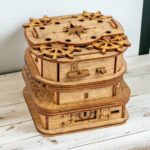 Intricate wooden mechanical puzzle box featuring gears, locks, and moving parts, designed for educational and decorative purposes.
