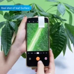 Close-up of a smartphone capturing a detailed image of a green leaf surface, showcasing the texture and veins of the plant.