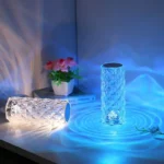 A decorative glass LED vase illuminated with blue light, creating a mesmerizing pattern on the surface. Perfect for science-themed decor and educational displays.