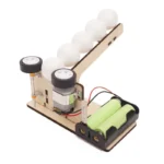 Educational magnetic ball and track experiment kit with motors and batteries for science learning and STEM activities.