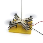 Educational magnetic pendulum setup with metal arm, base, and wiring for physics experiments and demonstrations.